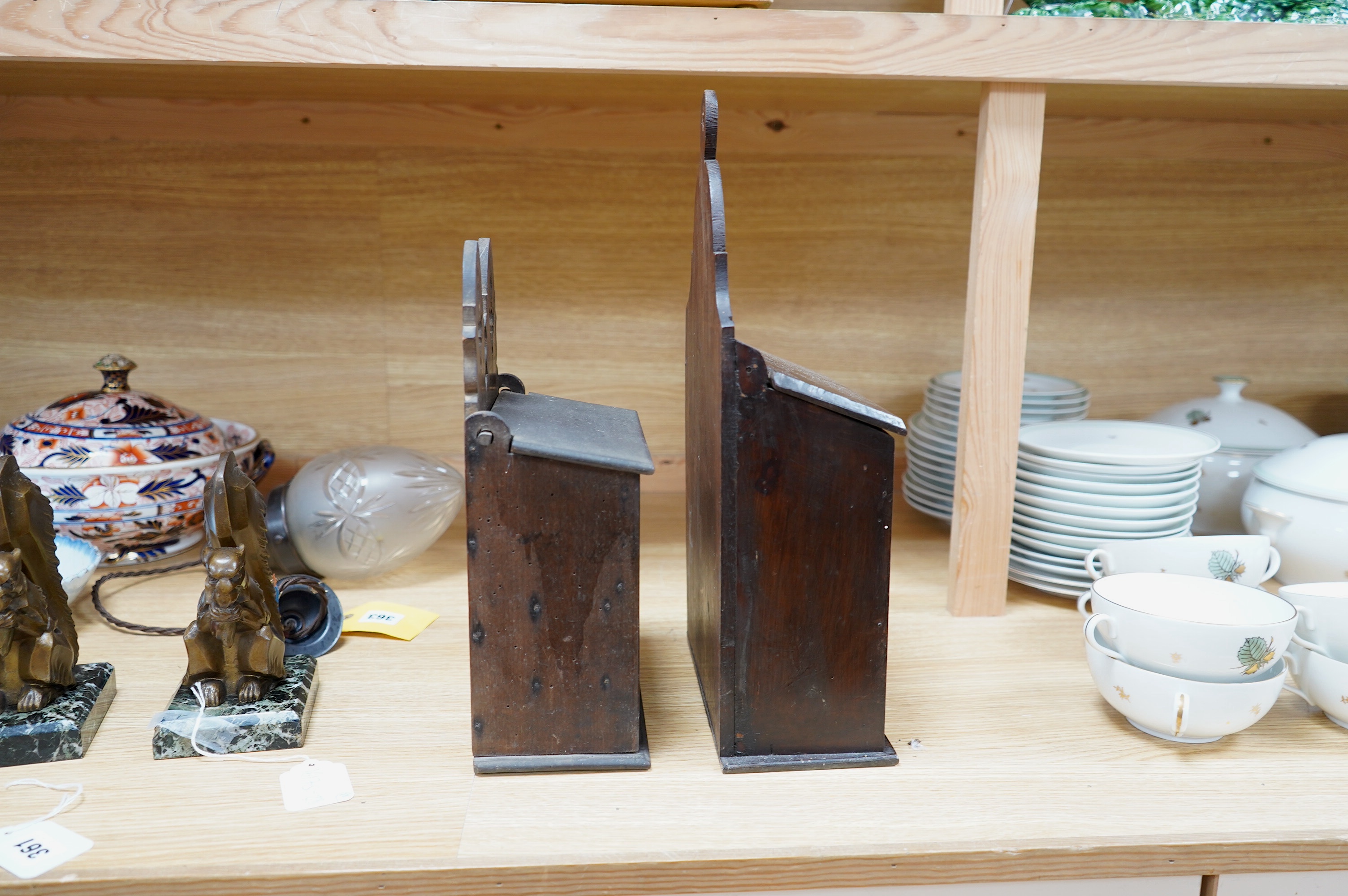 Two 19th century carved beech salt boxes, largest 40cm high. Condition - fair